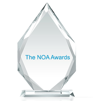 Crystal Award engraved in teal lettering with the words The NOA Awards